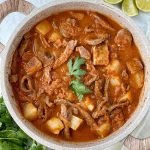 Pot with bistec con papas, or Mexican steak and potatoes