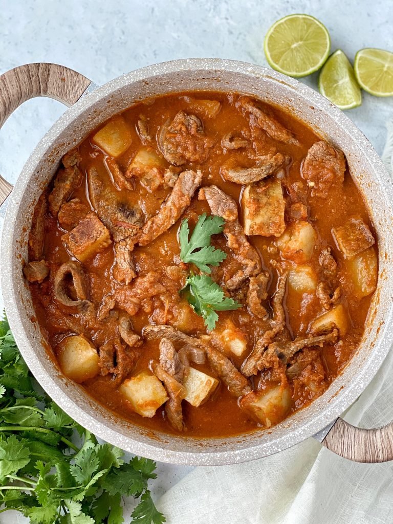 Pot full with bistec con papas, or mexican steak and potatoes.
