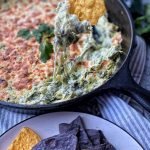 pan of spinach poblano dip with tortilla chips