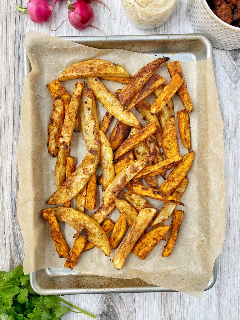 Oven roasted fries on a baking sheet